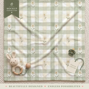 May include: A square baby blanket featuring a light green and cream checkered pattern with small daisy illustrations. A crocheted rabbit rattle with a wooden ring and a sage green pacifier with a tag reading Welcome Little One are included.