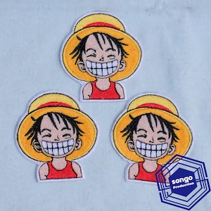 May include: Three embroidered patches featuring a cartoon character with black hair, a wide grin, and a yellow straw hat with a red band, wearing a red shirt. The bottom right patch includes a blue hexagonal logo with the text "songo Production".