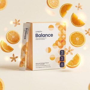 May include: A box and packet of Unicity Balance dietary supplement with orange slices and flowers. The box is white with orange accents and the text "Balance". The packet is white with the word "Balance".