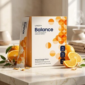 May include: A box of Unicity Balance drink mix with the text "Balance" and "The smart solution to balanced nutrition." The box is white with orange accents and is next to a packet of the drink mix and sliced oranges.