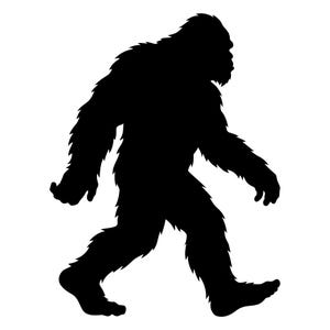 May include: A black silhouette of a Bigfoot creature walking to the right. The figure is covered in fur and has a large, human-like form. The image is set against a white background.