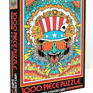 May include: A 1000 piece jigsaw puzzle featuring a psychedelic Uncle Sam illustration with a red, white, and blue top hat, sunglasses, and a long beard. The background is a colorful mix of stars, clouds, and lightning bolts.