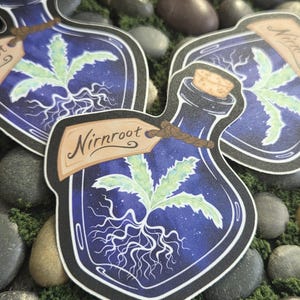 May include: A die-cut sticker shaped like a glass bottle with a cork stopper, containing a glowing light green plant with visible roots. A tan paper tag tied with twine around the bottle neck features the handwritten text Nirnroot in black ink.