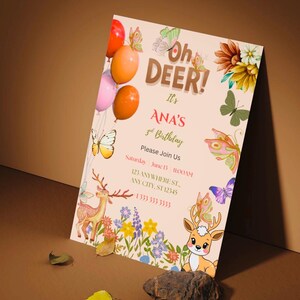 May include: A rectangular birthday invitation card featuring the text Oh DEER! It's ANA'S 3rd Birthday. The design includes illustrations of two cartoon deer, colorful butterflies, balloons, and wildflowers on a light beige background.