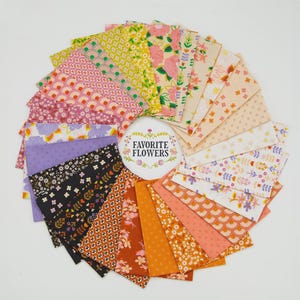 May include: A circular arrangement of fabric swatches featuring diverse floral and geometric patterns in shades of yellow, pink, purple, black, and orange. A central white circular label displays the text Favourite Flowers in black lettering.
