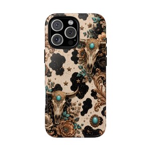 a phone case with a floral and skull design.