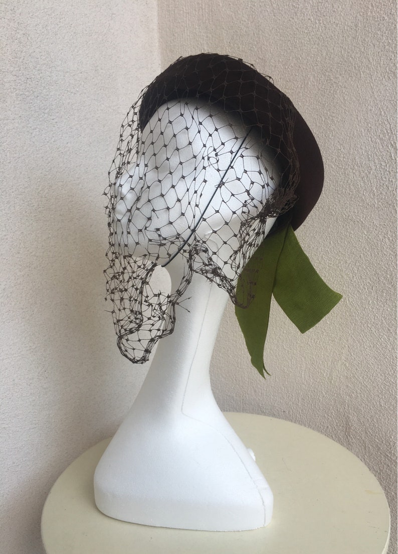 Vintage Mid Century bumper style brown wool hat with green ribbo Vintage Mid Century bumper style brown wool hat with green ribbo