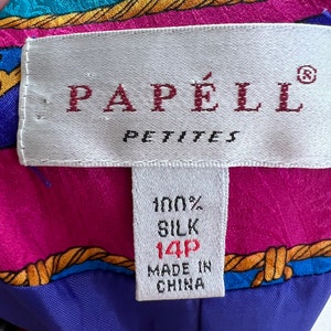 May include: A white tag with red text that reads "Papell Petites" and a smaller white tag with black text that reads "100% Silk 14P Made in China".