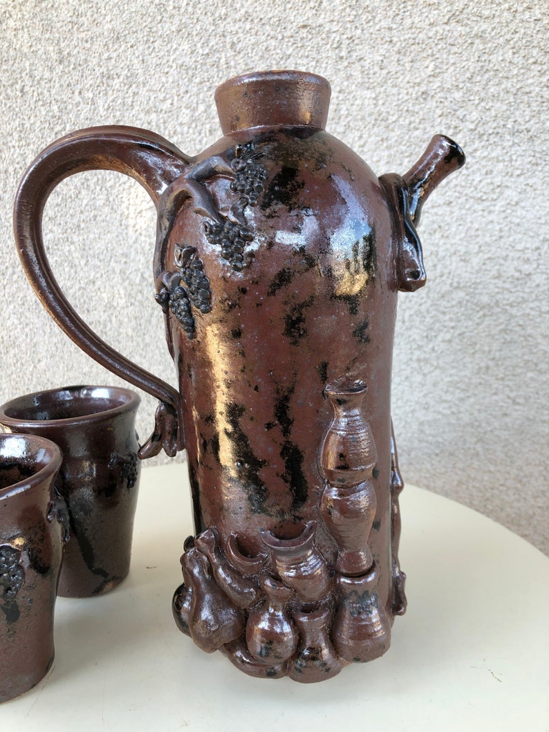Vintage funky art pottery wine decanter pitcher with 3 cups tribal nude theme brown pottery signed M Hess 1981 image 4
