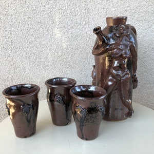 Vintage funky art pottery wine decanter pitcher with 3 cups tribal nude theme brown pottery signed M Hess 1981 image 1