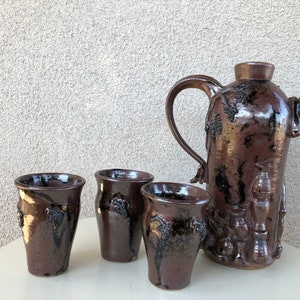 Vintage funky art pottery wine decanter pitcher with 3 cups tribal nude theme brown pottery signed M Hess 1981 image 2