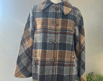 May include: A brown, gray, and orange plaid wool coat with a collar and toggle closures. The coat is on a mannequin and has a patch pocket on the left side.