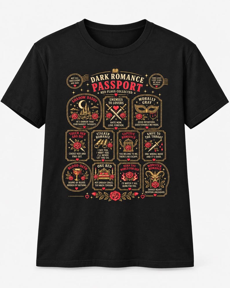 May include: A black short-sleeve t-shirt featuring a graphic titled Dark Romance Passport. The design includes twelve rectangular and circular frames with red roses, swords, masks, and text such as Shadow Daddy, Enemies to Lovers, and Morally Gray.