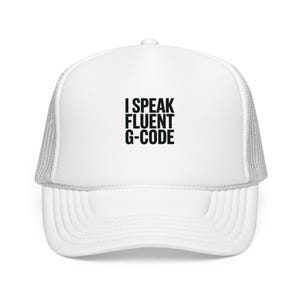 May include: White trucker hat with a curved brim and mesh back. The front of the hat features the text "I SPEAK FLUENT G-CODE" in bold, black letters. This hat is a great gift for anyone who works with CNC machines.