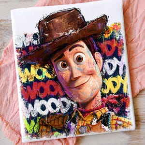 May include: A canvas print featuring a stylized portrait of the character Woody wearing a brown cowboy hat. The background is filled with vibrant, multi-colored graffiti-style paint splatters and the repeated text "WOODY" in various fonts.