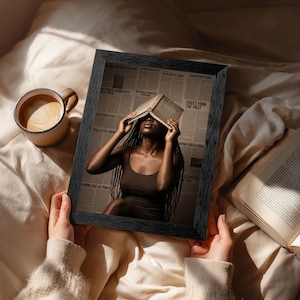 May include: A black framed print featuring a person with long dark braids holding an open book over their face. The background consists of newspaper columns with text including History and Truth, Voices from the Past, and Knowledge as Power.