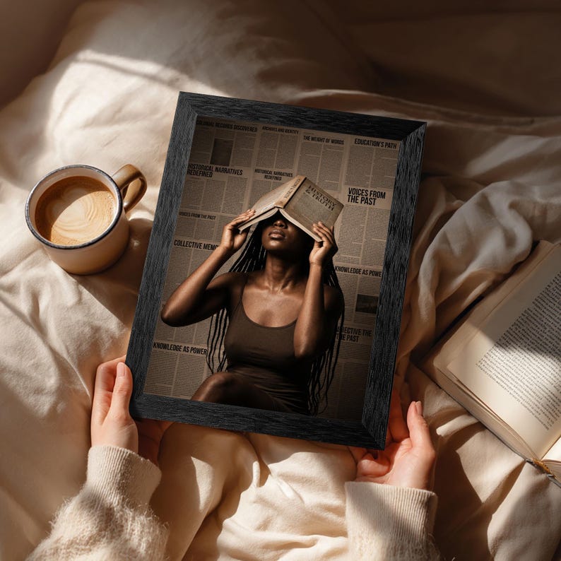 May include: A black framed print featuring a person with long dark braids holding an open book over their face. The background consists of newspaper columns with text including History and Truth, Voices from the Past, and Knowledge as Power.