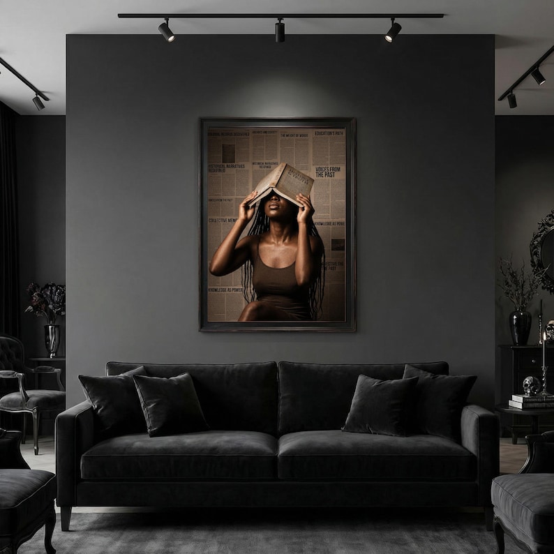 May include: A framed wall art print featuring a person with long dark braids wearing a brown tank top, holding an open book over their face. The background consists of a collage of vintage newspaper clippings with visible text headlines.