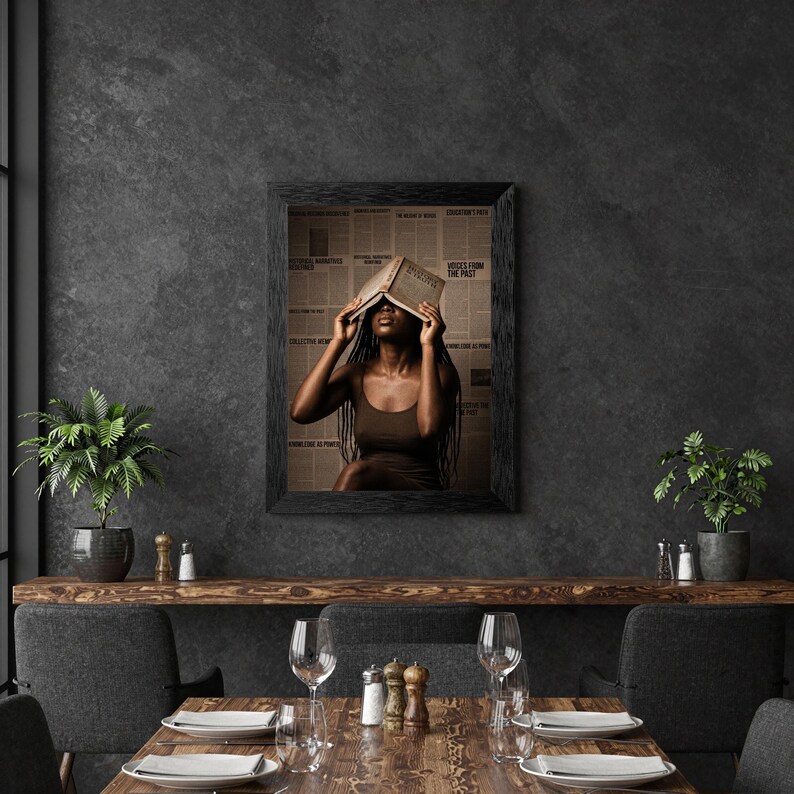 May include: A framed wall art print featuring a person with long dark braids wearing a brown tank top, holding an open book over their face. The background consists of a collage of vintage newspaper clippings with visible text and headlines.