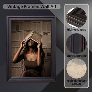 May include: A framed wall art piece featuring a person with long dark braids holding an open book over their face. The background consists of printed text columns. The frame is dark with a distressed finish. Includes circular detail insets.