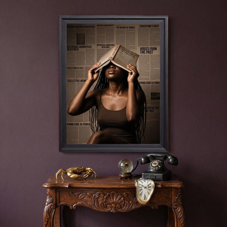May include: A framed wall art print featuring a person with long dark braids holding an open book over their face. The background consists of vintage newspaper columns with text including History and Truth, Voices from the Past, and Knowledge as Power.