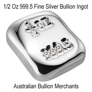 May include: A polished silver bullion ingot. The rectangular bar is stamped with "1/2 OZ" and "999.5" in raised lettering. The text "Australian Bullion Merchants" is printed below the bar.