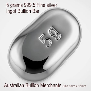 May include: A polished silver ingot bullion bar with the text "5g" embossed on its surface. The bar is marked "5 grams 999.5 Fine silver Ingot Bullion Bar". The bar measures approximately 8mm x 15mm.