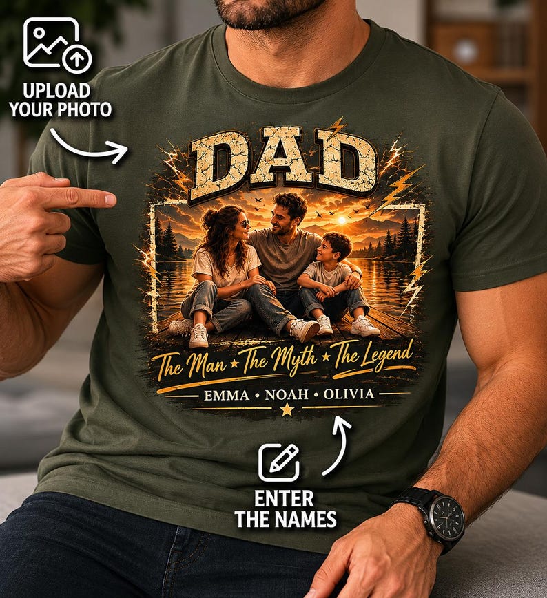 May include: Olive green t-shirt with a graphic featuring the word "DAD" in large, bold letters above a family portrait. The text "The Man * The Myth * The Legend" and names are below the image. Includes prompts to upload a photo and enter names.