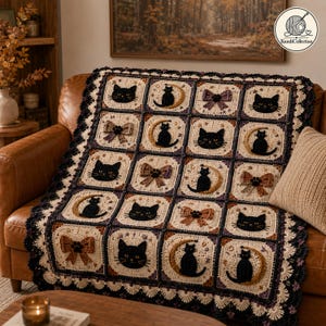 May include: A crochet blanket featuring a grid of square motifs with black cat faces, black cats sitting on crescent moons, and decorative bows. The blanket is crafted in cream, brown, and black yarn with a dark scalloped border edge.