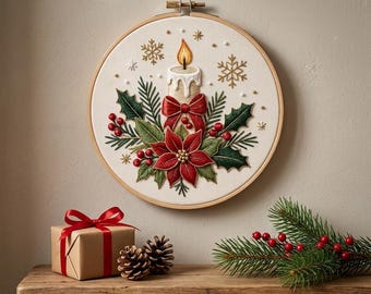 May include: A circular wooden embroidery hoop containing a white fabric panel with a hand-stitched design of a lit candle, a red poinsettia, holly leaves, red berries, and gold snowflakes, accented with small gold beads throughout the composition.