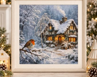 Puede incluir: Un cuadro de pintura de diamantes cuadrado con una escena invernal que muestra un petirrojo posado en una rama cubierta de nieve en primer plano. Al fondo, una casa acogedora con ventanas amarillas brillantes y una chimenea con humo.