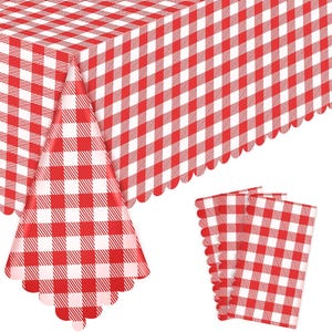 May include: A rectangular tablecloth featuring a red and white checkered gingham pattern with a scalloped edge, accompanied by a set of matching folded napkins that display the same consistent red and white square grid design throughout.