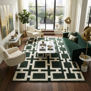 May include: A rectangular area rug featuring a dark green and cream geometric pattern of interlocking squares and lines. The rug is positioned in a living room setting with two cream armchairs, a dark green sofa, and a white marble coffee table.