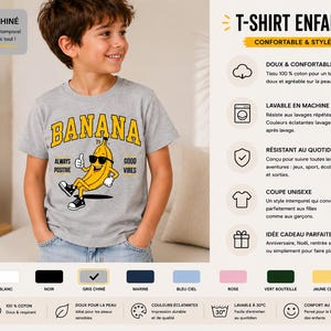 K&ouml;nnte beinhalten: Ein graues, meliertes Kurzarm-T-Shirt mit einer Grafik einer gelben Banane, die eine schwarze Sonnenbrille und Turnschuhe tr&auml;gt und den Daumen hochh&auml;lt. Der Text BANANA steht in Gelb dar&uuml;ber, mit ALWAYS POSITIVE und GOOD VIBES an den Seiten.