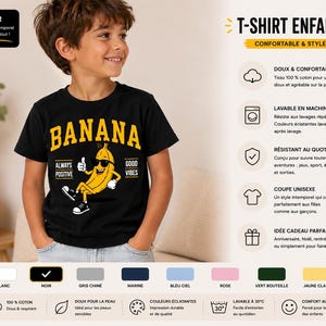 K&ouml;nnte beinhalten: Ein schwarzes T-Shirt mit kurzen &Auml;rmeln und einer gelben Cartoon-Bananenfigur, die eine Sonnenbrille und Turnschuhe tr&auml;gt. Der Text BANANA ist in gro&szlig;en gelben Buchstaben &uuml;ber der Figur gedruckt, mit ALWAYS POSITIVE und GOOD VIBES an den Seiten.