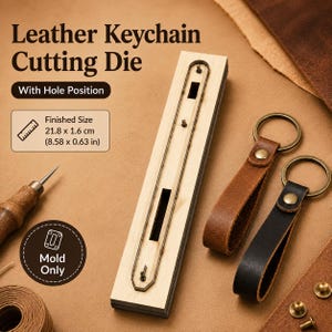 May include: A rectangular wooden leather keychain cutting die with a metal blade outline, featuring text "Leather Keychain Cutting Die", "With Hole Position", and "Finished Size 21.8 x 1.6 cm (8.58 x 0.63 in)". Includes two finished leather keychains.