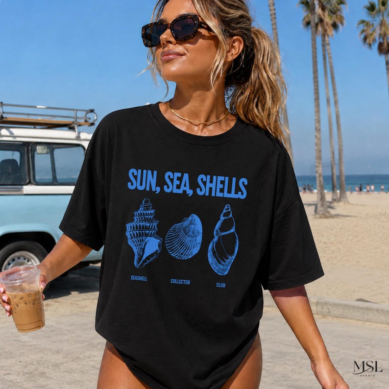 Bring effortless seaside energy to your summer wardrobe with this Sun Sea Shells Shirt 🌊