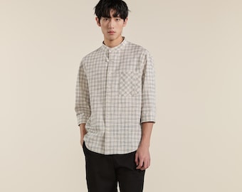 Camisa de hombre holgada de algodón elástico con cuello mandarín y estampado de cuadrícula en blanco y negro.