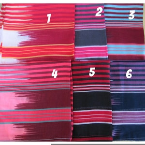 May include: Six different striped fabric swatches in various colors, including red, pink, blue, black, and purple. The swatches are numbered 1 through 6.