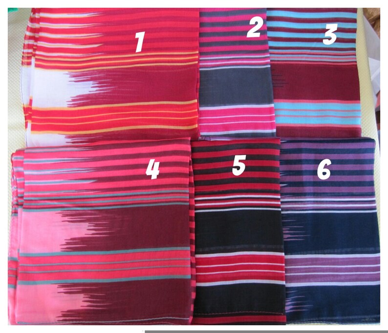 May include: Six different striped fabric swatches in various colors, including red, pink, blue, black, and purple. The swatches are numbered 1 through 6.