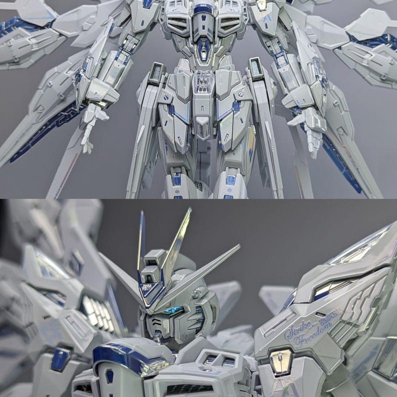 May include: A detailed, two-part image showcasing a white and blue model robot. The top section displays the robot's torso and wings, while the bottom focuses on the head and chest, with the text "Strike Freedom" visible. The model features intricate detailing.