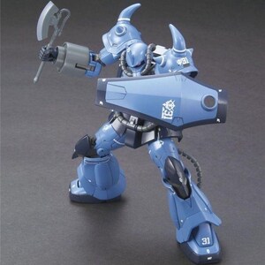 May include: A blue robot action figure with a spiked shoulder armor, holding a gray battle axe in one hand and a large blue shield in the other. The shield features the white text 31 and a white emblem. The robot has dark blue accents and joints.
