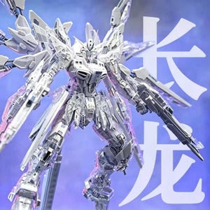 May include: A clear, articulated robot model with intricate details, holding two large guns. The model has multiple wings and is posed against a blue background with white Chinese characters.
