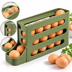 May include: An olive green plastic egg dispenser with three tiered levels for storage. The gravity-fed design allows eggs to roll forward into a front tray. The unit holds multiple brown eggs, with additional eggs placed on the surface nearby.