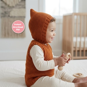 May include: A rust-colored knitted vest and a matching pointed pixie-style bonnet with a ribbed trim. The garment set is worn over a cream-colored long-sleeved shirt. A pink circular badge with the white text Instant download PDF is visible.