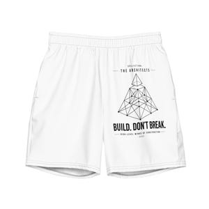 May include: White athletic shorts with an elastic waistband and side pockets. The shorts feature a geometric design and the text "BUILD. DON'T BREAK." The text "COLLECTION - THE ARCHITECTS" is also printed on the shorts.