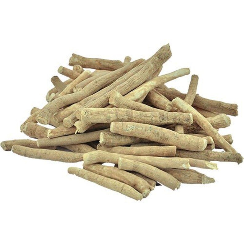May include: A pile of dried, light tan, cylindrical plant roots. The roots are woody, textured, and vary in length and thickness, featuring a rough, fibrous surface with natural markings and irregular shapes stacked together in a cluster.