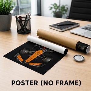 May include: A rectangular poster featuring a top-down view of a McLaren Formula 1 race car in its signature orange and black livery. The poster is shown partially unrolled next to a brown cardboard shipping tube on a wooden desk surface.