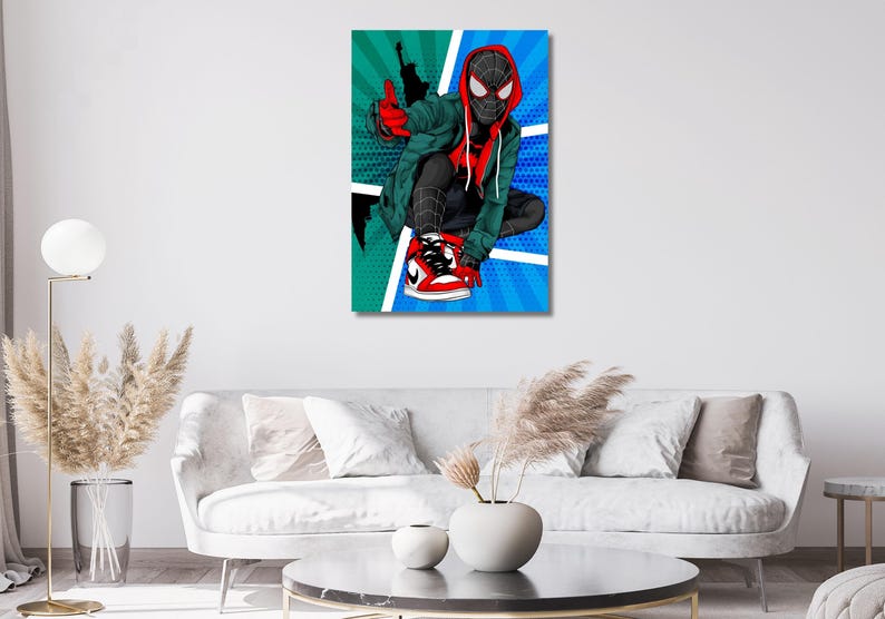 May include: A rectangular wall art print featuring a stylized comic book illustration of a masked character in a red and black suit, wearing a green hooded jacket and red and white sneakers, set against a vibrant teal and blue radial background.