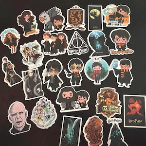 May include: A collection of assorted vinyl stickers featuring various characters, crests, and symbols from the Harry Potter series. The designs include chibi-style illustrations, the Deathly Hallows symbol, Hogwarts house emblems, and movie-inspired scenes.